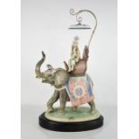 A large Lladro porcelain group titled Indian Princess; elephant and rider under a parasol canopy,