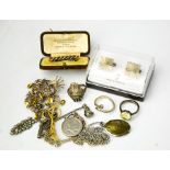 A tie pin in presentation box, a silver necklace with Canadian 25 cents pendant, silver rings,