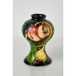 A Moorcroft vase, in the Queens Choice pattern designed by Emma Bossons, dated 2000, 15cm high.