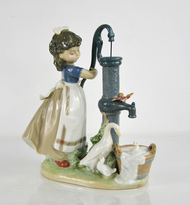 A Lladro porcelain group titled Summer at the Farm, numbered 5285, 24cm high.