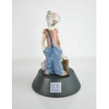 A Lladro porcelain clown on stand, limited edition, signed to the base and dated 11.6.97, 20cm high,