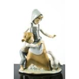A Lladro porcelain figure group titled Avoiding the Goose, number 5033, 25cm high.