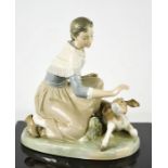 A Lladro porcelain group titled Caressing a Little Calf, number 4827, 18cm high.
