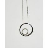 A 9ct white gold circle and diamond pendant, 3.05g