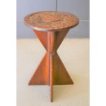 An oak table with circular carved top and shaped base, 52cm