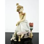 A Lladro porcelain figurine titled Chit Chat, girl on the phone with dog, number 5466, boxed, 19cm