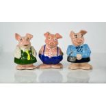 Three Wade Natwest piggy banks.