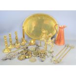 A quantity of brass and copper ware to include, andirons, candlesticks, horse brasses etc