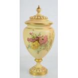 A Royal Worcester blush ivory vase and cover painted with flowers and gilt ribbed cover, c1910, 27cm
