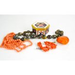 An amber pendant, Royal Crown Derby pin dish and cover, a beaded coral necklace and a pair of