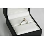 An 18ct white gold and diamond solitaire ring, by The Leo, the brilliant cut diamond 0.55ct, size