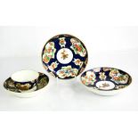 A group of first period Worcester porcelain; tea bowl & saucer and two plates.