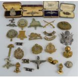 A group of WWI and WWII brooches to include a 1914-1915 artillery brooch and some silver examples