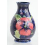 A small William Moorcroft vase in the Pansy pattern, signed to base, 12cm