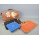A leather doctors bag, two leather cases, Kingston bag, American world airways label.