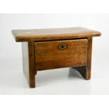 A rare early 19th century oak stool with drawer.