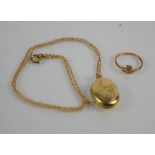 A 9ct gold locket pendant and chain, together with a 9ct gold claddagh ring. 6.9g