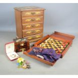 A miniature chest of drawers with flower decoration together with a quantity of brooches, Timex