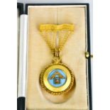 A 9ct gold Masonic medallion, with the circular blue enamel pendant suspended from six chain pin, in