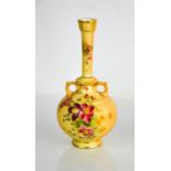 Two Royal Worcester blush ivory narrow neck vases, painted with flowers, one of bulbous form, the