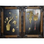 A pair of late 19th / early 20th century black lacquered panels, decorated with ivory plum blossom