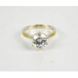 An 18ct white gold dress ring, with brilliant cut solitaire, size P, 5.79g.