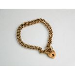 A 9ct gold bracelet, chain link, with heart form clasp and safety chain, each link stamped 375, 25.