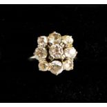 An 18ct white gold and diamond cluster ring, the diamonds totalling approximately 1.30ct, size L½,