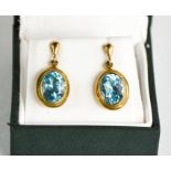 A pair of 9ct gold and blue topaz earrings, 5.36g.