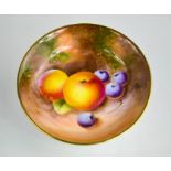 Two Royal Worcester circular pin trays, 11cm and 10cm diameter, painted with fruit on a mossy