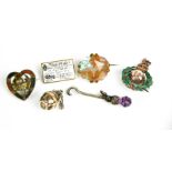 Three brooches, including a Scottish silver and agate example, a silver charm and a thistle form