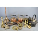 A group of brass and copper ware to include kettles, candlesticks, scuttle etc