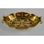 A Royal Crown Derby 1128 pattern oval tray with scroll decoration 14cm long.