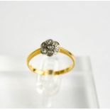 An 18ct gold and diamond flowerhead ring 3.2g.