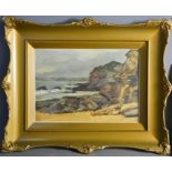 A 20th century oil on board, rocky beach, 34 by 24cm.