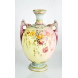 A Royal Worcester porcelain vase, decorated with sprays of flowers on a pink ivory ground, date code