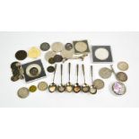A white metal set of coffee spoons, knife rest and group of coins including silver and commemorative
