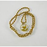 A 9ct gold ropetwist necklace and gilt metal pendant, 7.96g total.