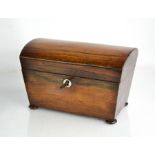 A Victorian rosewood tea caddy, the dome top enclosing two lidded interior canisters, raised on