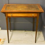 A leather top mahogany side table with single drawer.