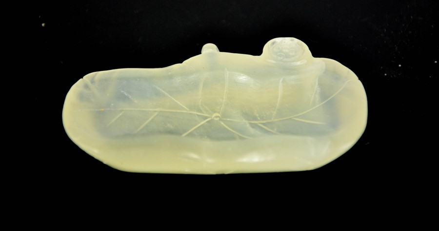 A Chinese green jade Heitian jade carved ink stand.