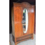 An Edwardian mahogany wardrobe with single door and drawers. 209cm high by 170cm wide by 45cm