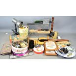 A group of collectibles to include butter pats, wooden candle sticks, angle lamp, purse, postcards