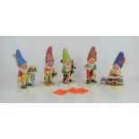 A group of five Goebel figurines to include Kuni the Painter, John the Hunter, Bob the Bookworm,