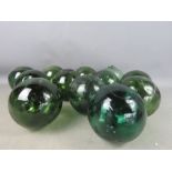 A group of vintage green glass fishing floats