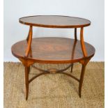 A 19th century oval etagere with two shelves, finely decorated with inlaid urns, musical groups