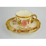 A Royal Worcester trio of blush ivory and floral painted cup, saucer and plate with gilded handles