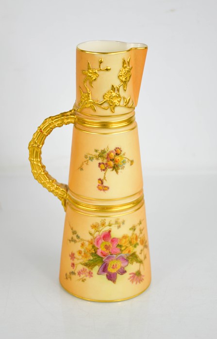 A Royal Worcester tusk jug painted with panels of flowers with gilded bark handle and spout, circa