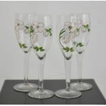 Four Perrier Jouet Champagne flutes.