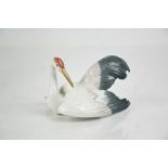 A Lladro porcelain Fluttering Crane, signed to the base Lladro, and dated 27.4.90, no. 1599, 8cm